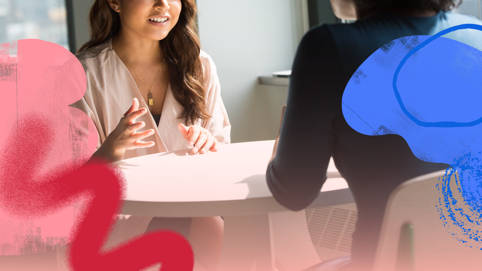 Two women having a discussion sitting at a table. Colorful abstract illustrated shapes in red, pink, and blue are in the forefront.