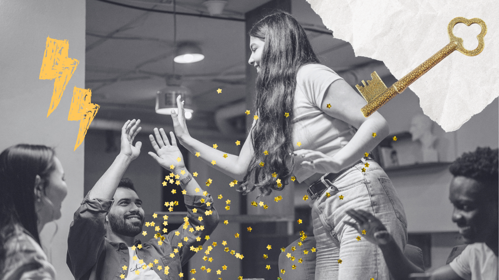 A group of young people are smiling at each other, having fun. A girl reaches out to give a high-five to one of the boys in the group.